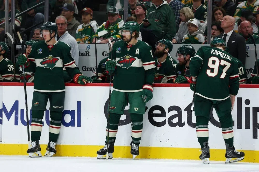 Wild players gather around the bench during Game 4 of their playoff series against the Avalanche.